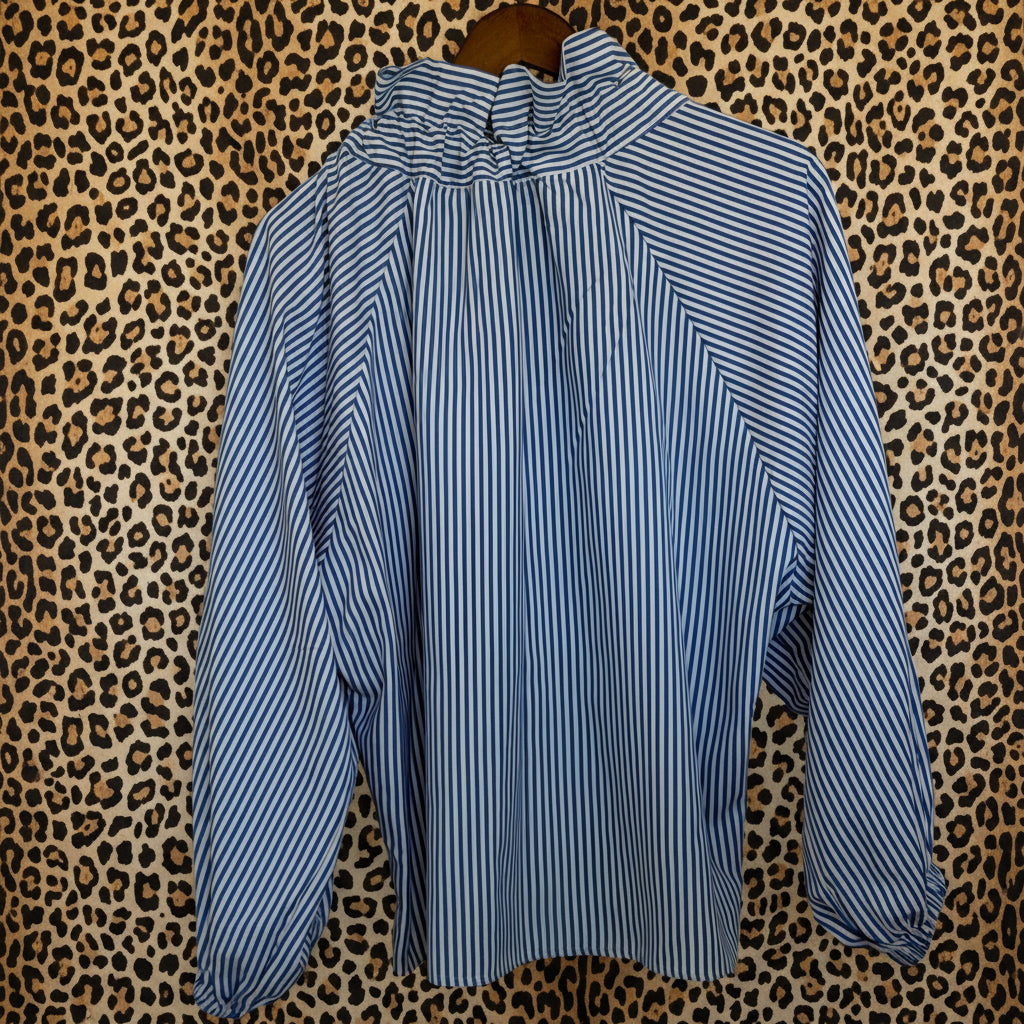 Blue and white striped shirt on a leopard background